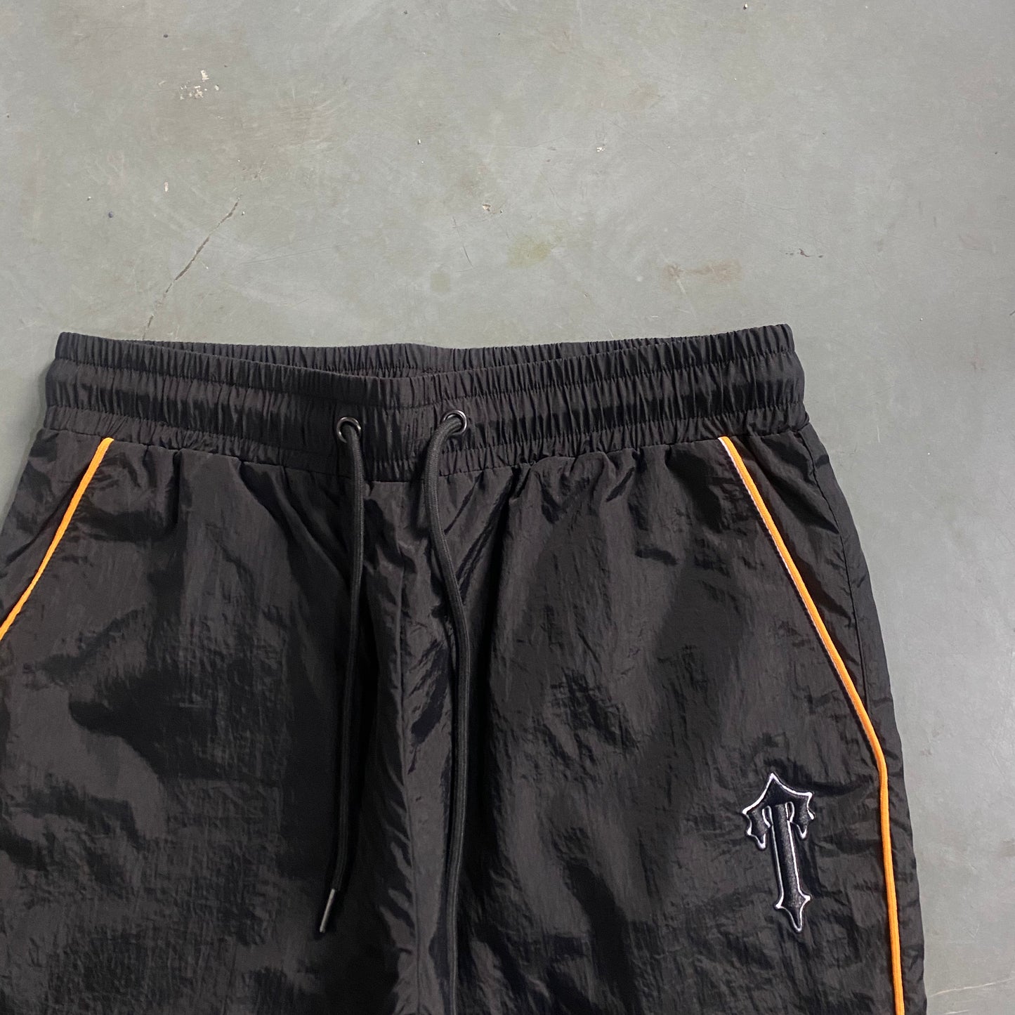 ARCH BLACK/ORANGE SHELLSUIT