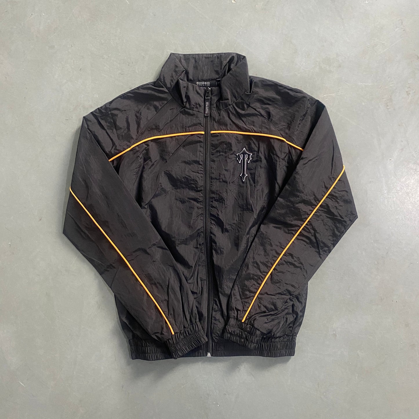 ARCH BLACK/ORANGE SHELLSUIT
