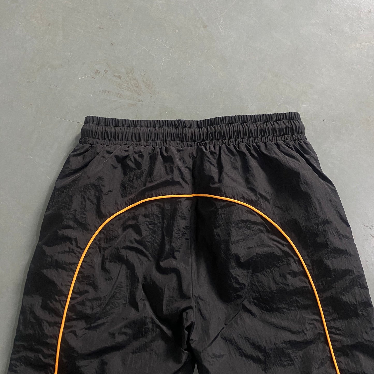 ARCH BLACK/ORANGE SHELLSUIT