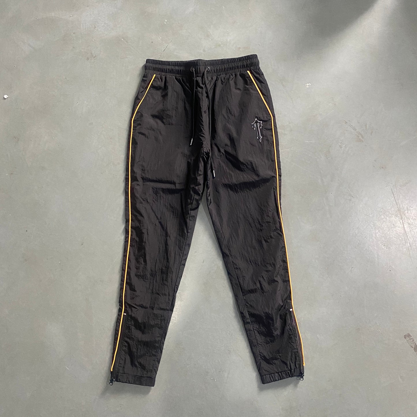 ARCH BLACK/ORANGE SHELLSUIT