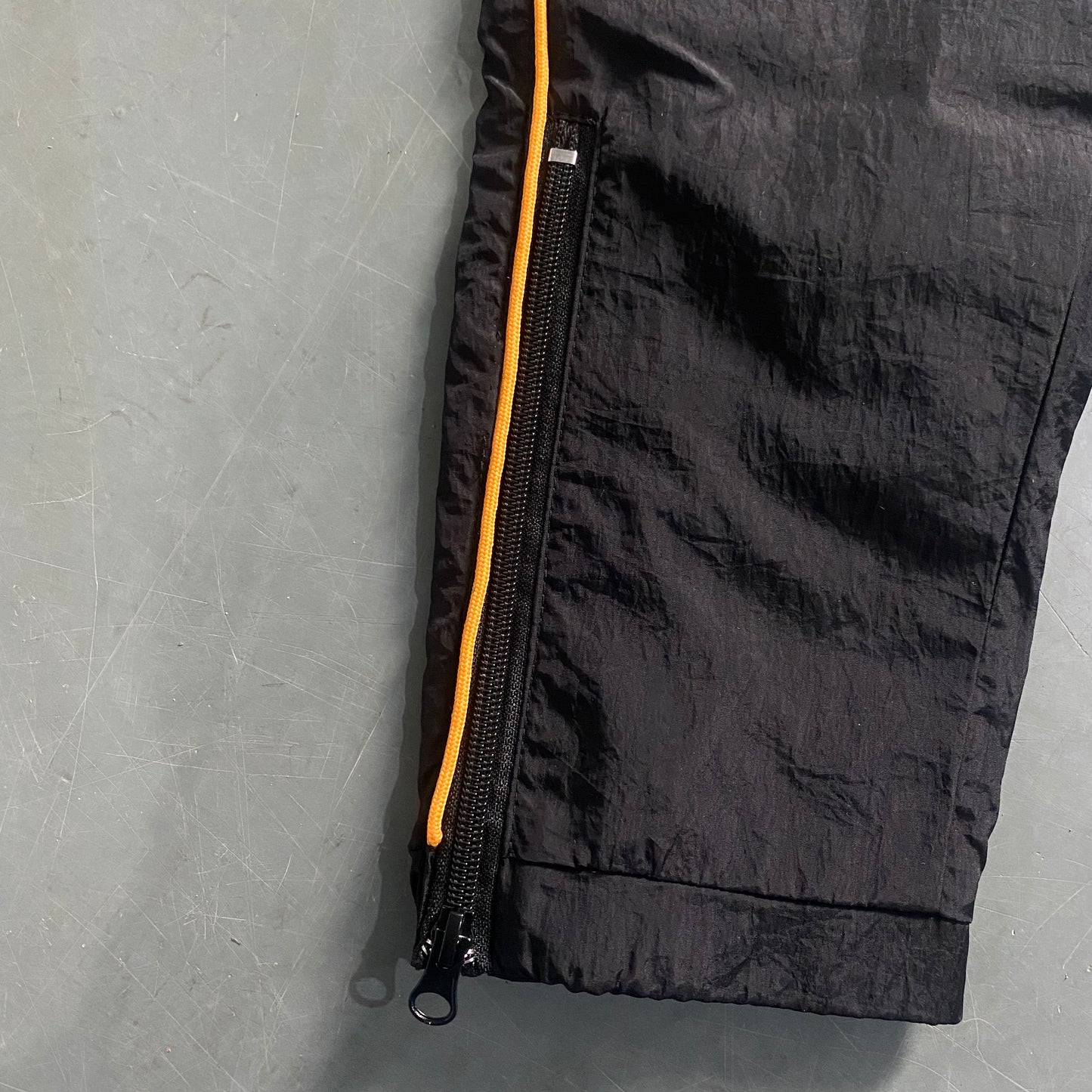 ARCH BLACK/ORANGE SHELLSUIT