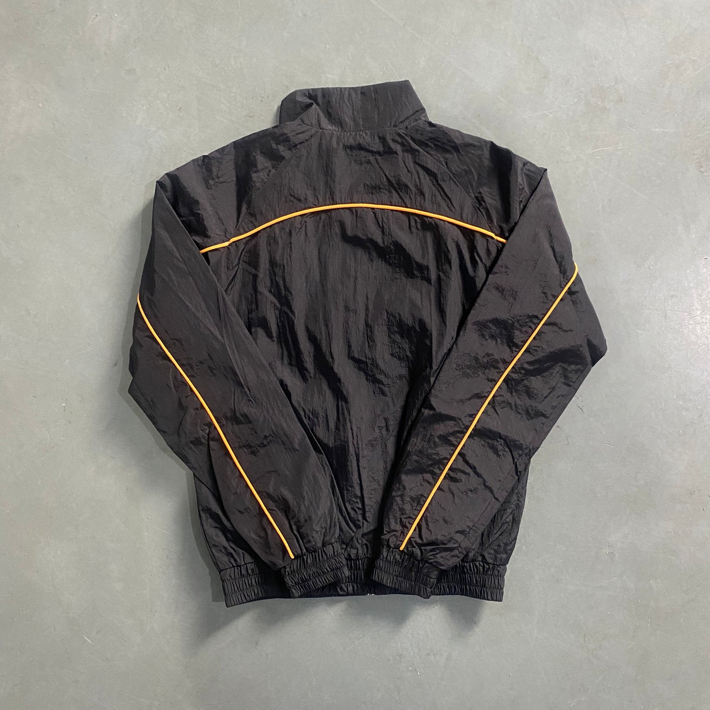 ARCH BLACK/ORANGE SHELLSUIT